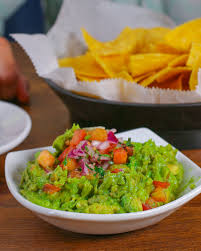 El Cerro Bar and Grill signature dishes Tableside GuacamoleSizzling FajitasShrimp and Steak Burrito